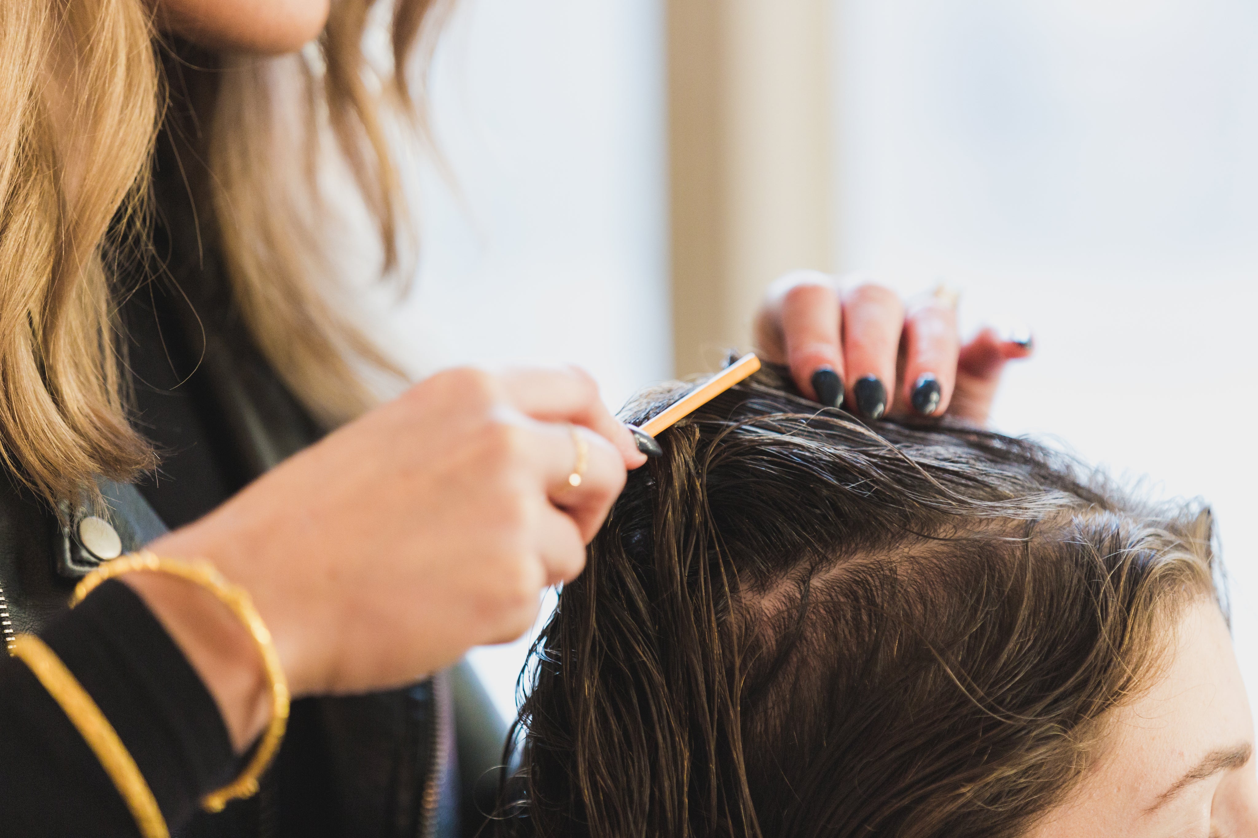 files/close-up-stylist-parting-hair.jpg